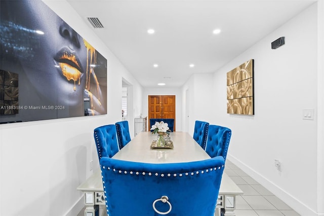 811 W 33rd St, Hialeah, FL 33012 - tiled dining room with baseboards and recessed lighting