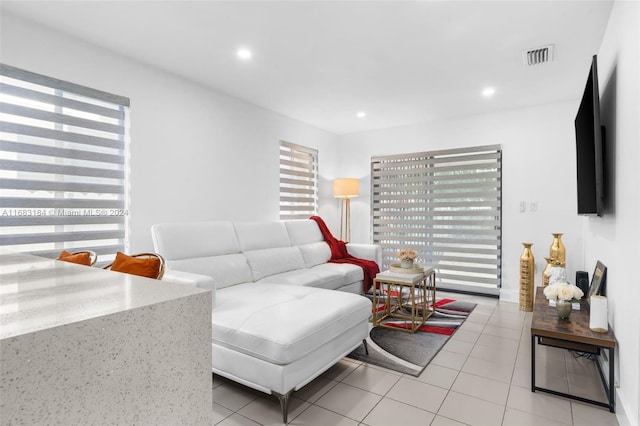 811 W 33rd St, Hialeah, FL 33012 - living area with light tile patterned floors and recessed lighting