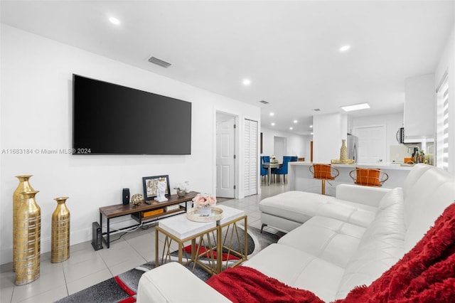 living room with light tile patterned flooring