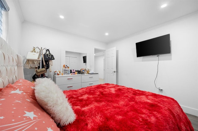 811 W 33rd St, Hialeah, FL 33012 - bedroom with crown molding, recessed lighting, and wood finished floors