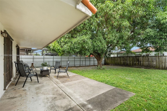 811 W 33rd St, Hialeah, FL 33012 - fenced backyard with a patio