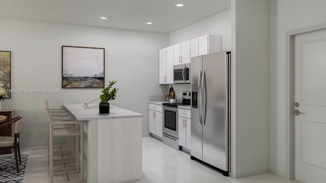 15601 SW 280th St Unit 4, Miami, FL 33031 - kitchen with stainless steel appliances, light countertops, white cabinets, recessed lighting, and a breakfast bar