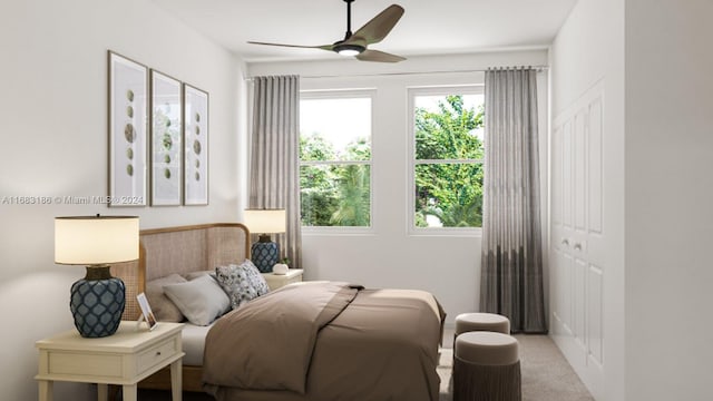 bedroom featuring light colored carpet, a closet, and ceiling fan