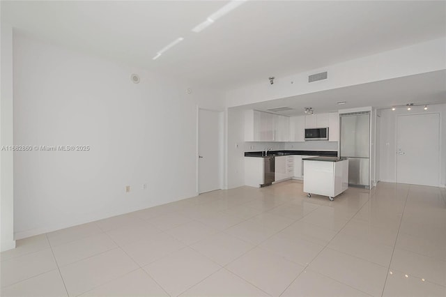 interior space featuring light tile patterned floors