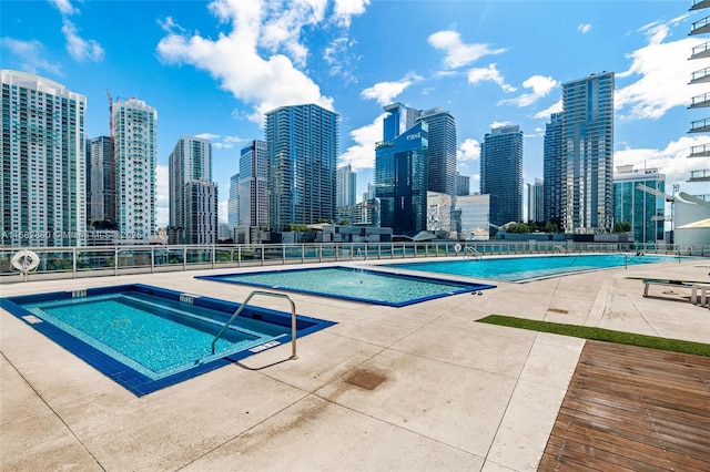 view of swimming pool featuring a patio area