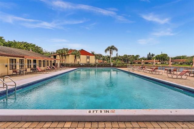 view of swimming pool with a patio