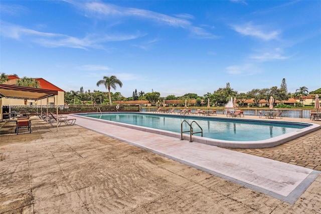 view of swimming pool with a patio area