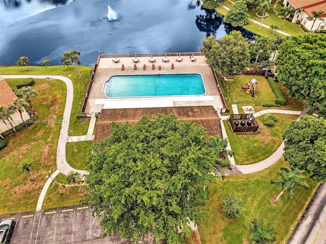 birds eye view of property with a water view