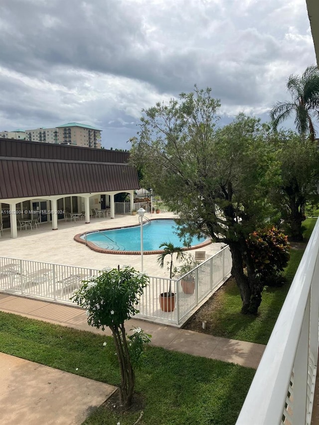 view of swimming pool featuring a patio