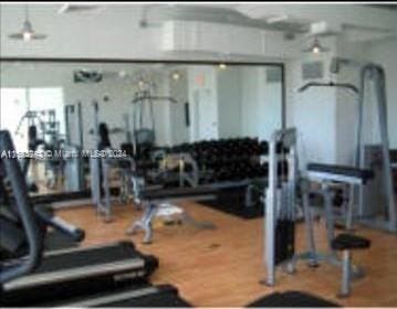 gym featuring hardwood / wood-style floors