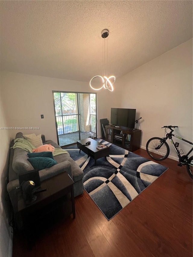 living room featuring hardwood / wood-style floors and a textured ceiling