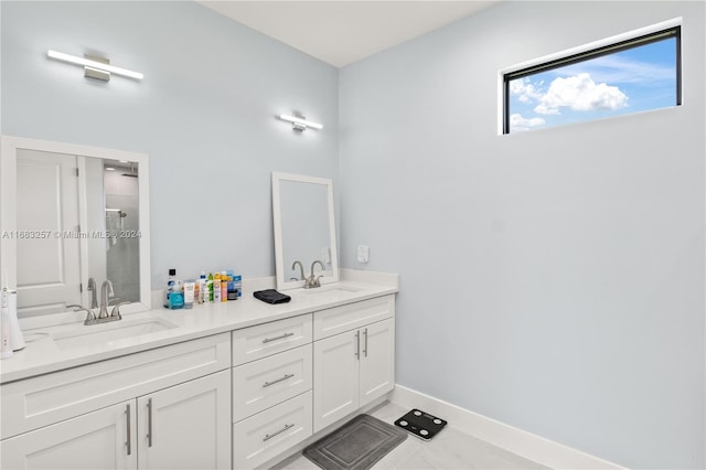 bathroom with vanity and walk in shower