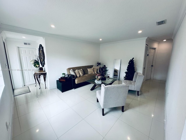 tiled living room with ornamental molding and a textured ceiling