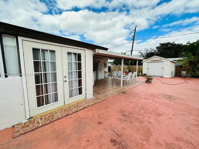 view of patio / terrace with french doors and a shed