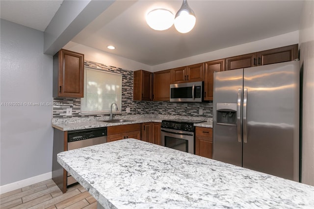2510 SW Natura Blvd, Deerfield Beach, FL 33441 - kitchen featuring appliances with stainless steel finishes, tasteful backsplash, light wood-type flooring, and recessed lighting