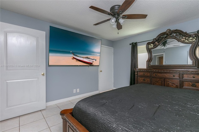 2510 SW Natura Blvd, Deerfield Beach, FL 33441 - bedroom with light tile patterned flooring, ceiling fan, and a textured ceiling