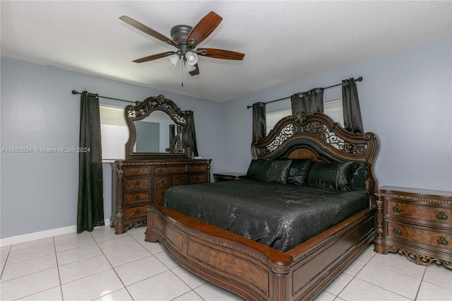 2510 SW Natura Blvd, Deerfield Beach, FL 33441 - bedroom with light tile patterned floors, a ceiling fan, and a textured ceiling