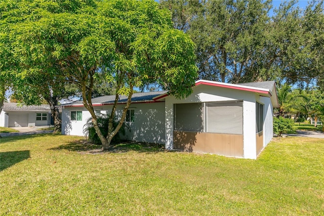 2510 SW Natura Blvd, Deerfield Beach, FL 33441 - view of front of property featuring a front yard and stucco siding