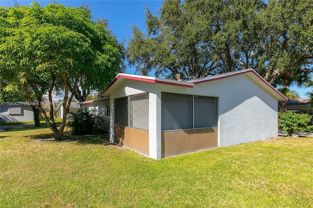 2510 SW Natura Blvd, Deerfield Beach, FL 33441 - view of property exterior with stucco siding and a yard