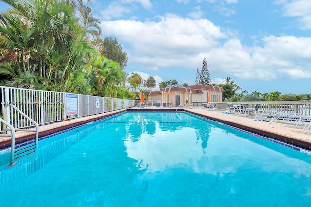 view of swimming pool with a patio area