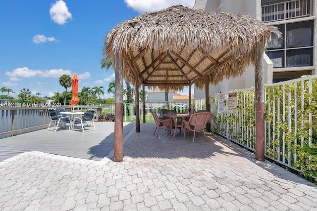 view of patio / terrace featuring a gazebo and a water view