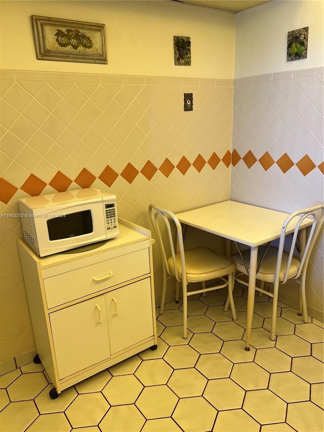 kitchen with tile walls and light tile patterned floors