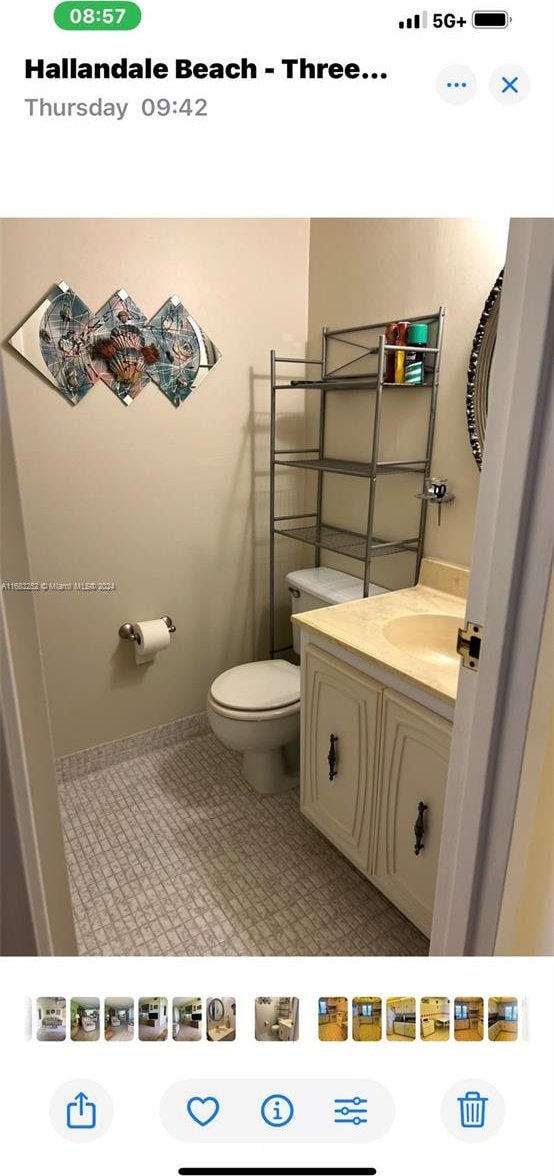 bathroom featuring vanity, toilet, and tile patterned floors