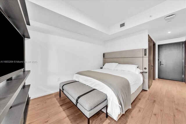 bedroom with light wood-type flooring