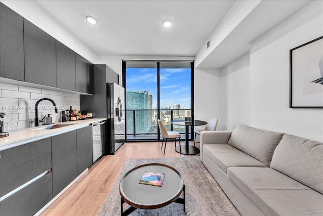 398 NE 5th St Unit 3707, Miami, FL 33132 - living area featuring expansive windows and light wood-style flooring