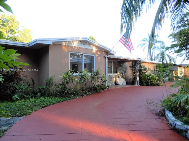 view of front facade with a patio area