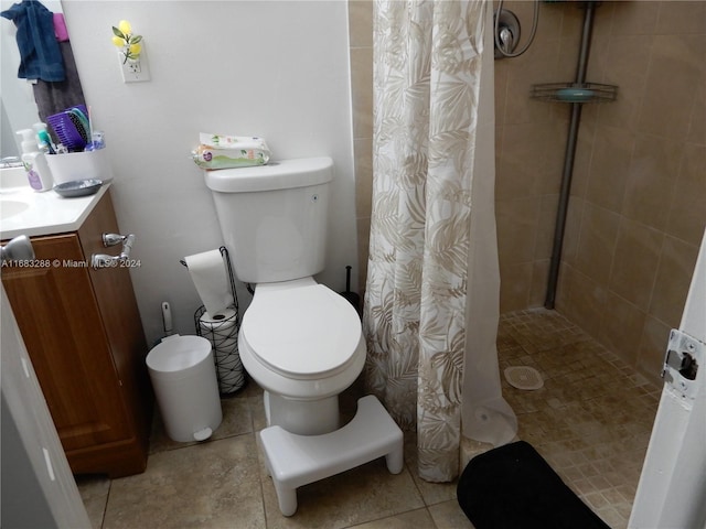 bathroom featuring toilet, vanity, and a shower with shower curtain