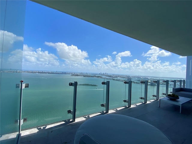 balcony featuring a water view