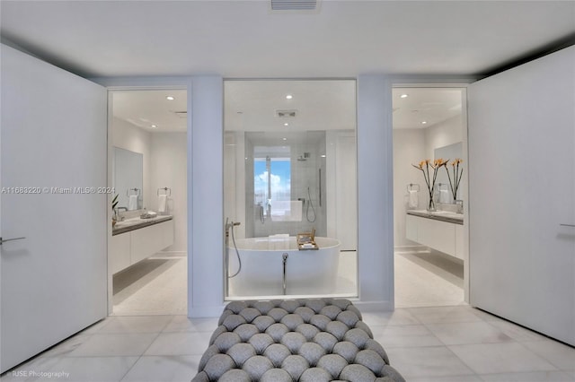 bathroom featuring vanity and separate shower and tub