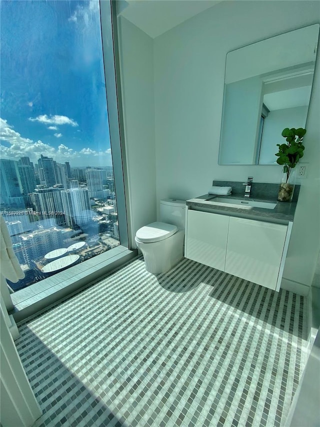 bathroom featuring vanity and toilet