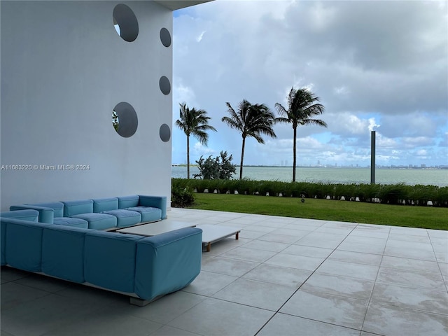 view of patio featuring a water view and outdoor lounge area