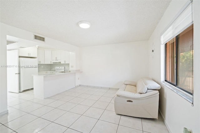 interior space with a textured ceiling