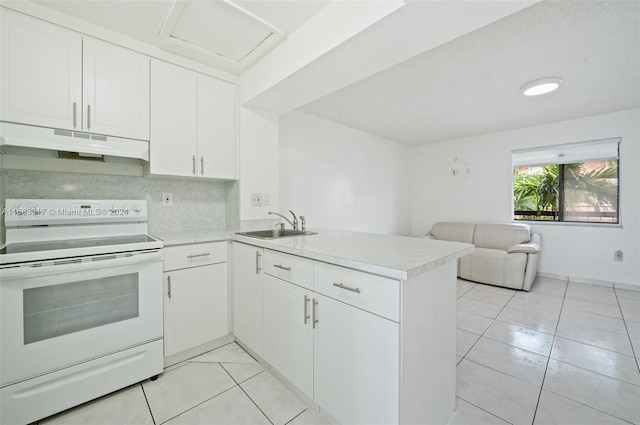 kitchen with kitchen peninsula, sink, white range with electric stovetop, light tile patterned flooring, and white cabinetry