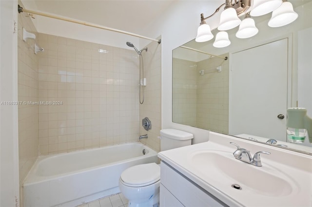 full bathroom featuring vanity, toilet, tile patterned floors, and tiled shower / bath combo