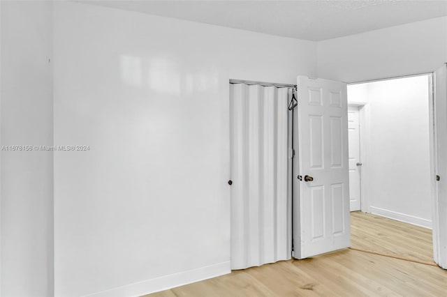 unfurnished bedroom featuring wood-type flooring