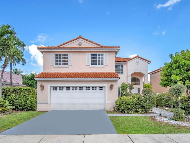 mediterranean / spanish-style home featuring a garage