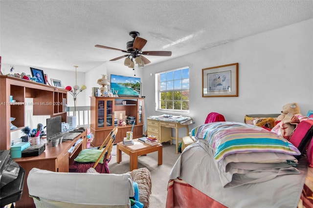 interior space with ceiling fan and a textured ceiling