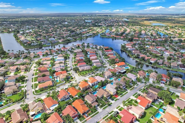 drone / aerial view with a water view