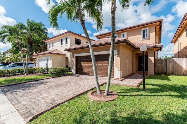 mediterranean / spanish-style home featuring a front lawn