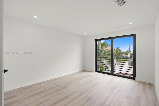 unfurnished room featuring light hardwood / wood-style flooring