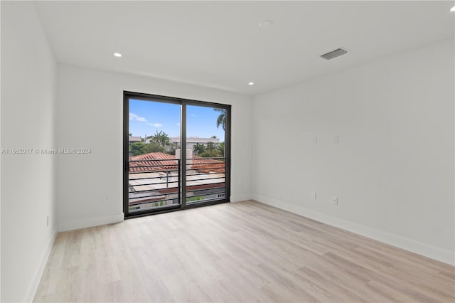 unfurnished room featuring light hardwood / wood-style floors