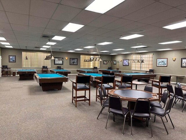 game room with pool table, a paneled ceiling, and carpet floors