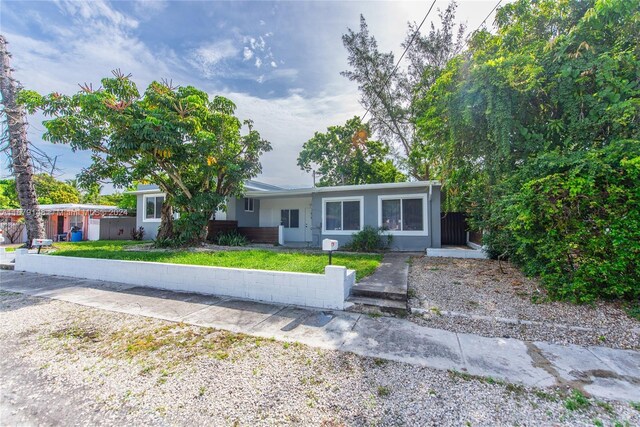 11515 NE 12th Ave, Miami, FL 33161 - view of front facade featuring a front yard