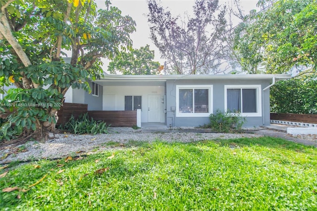 ranch-style house with a front yard