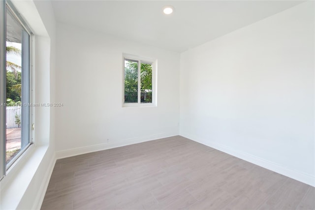 spare room with light wood-type flooring