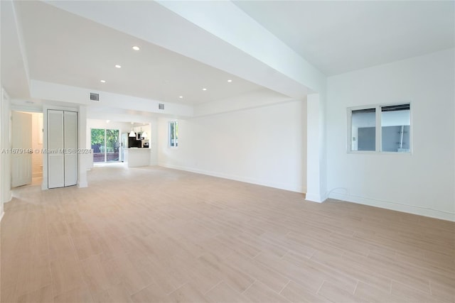 unfurnished living room with light hardwood / wood-style flooring